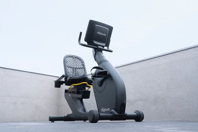 recumbent bike positioned in a white and grey background